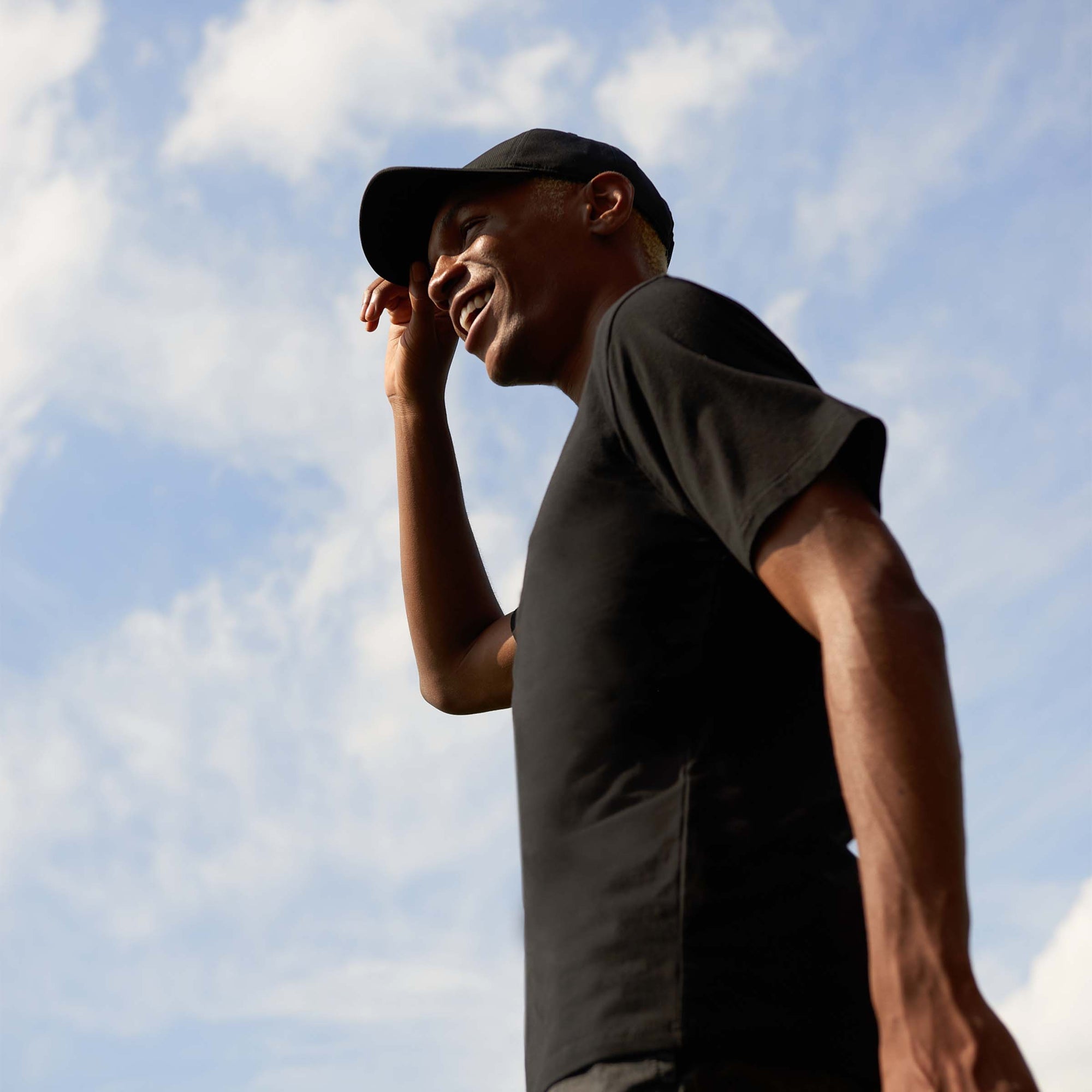 black t-shirt sky background relaxed