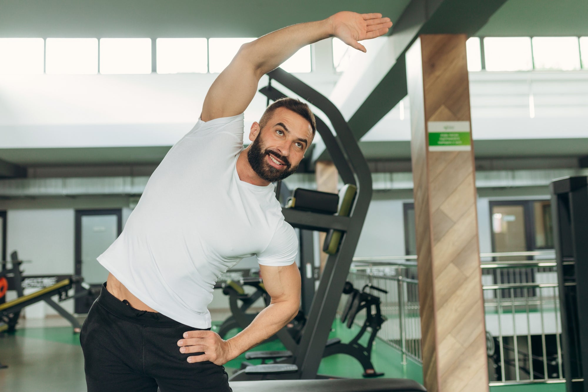 man wearing white t-shirt that prevents pit stains