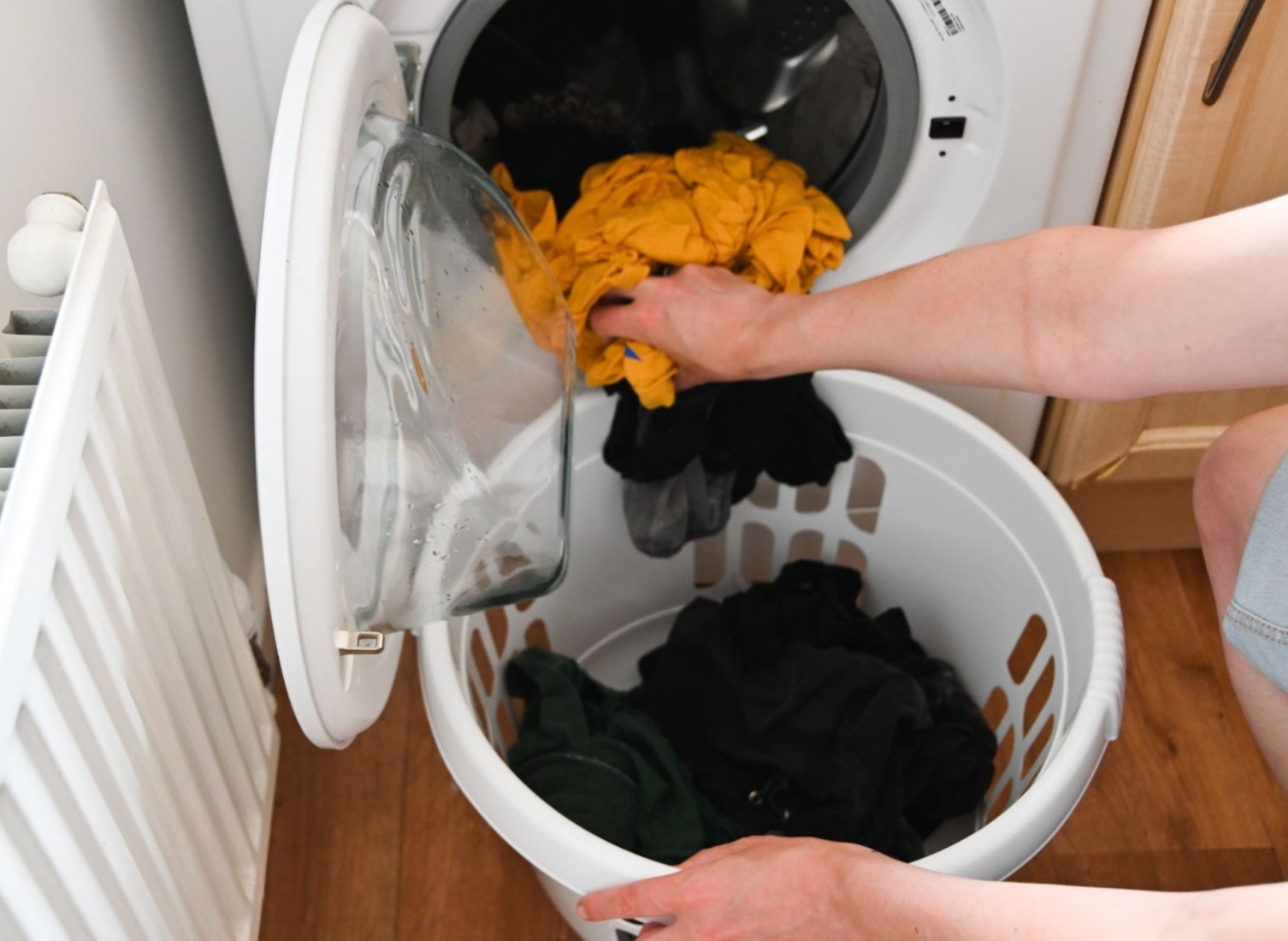 Clothes being emptied from a washing machine